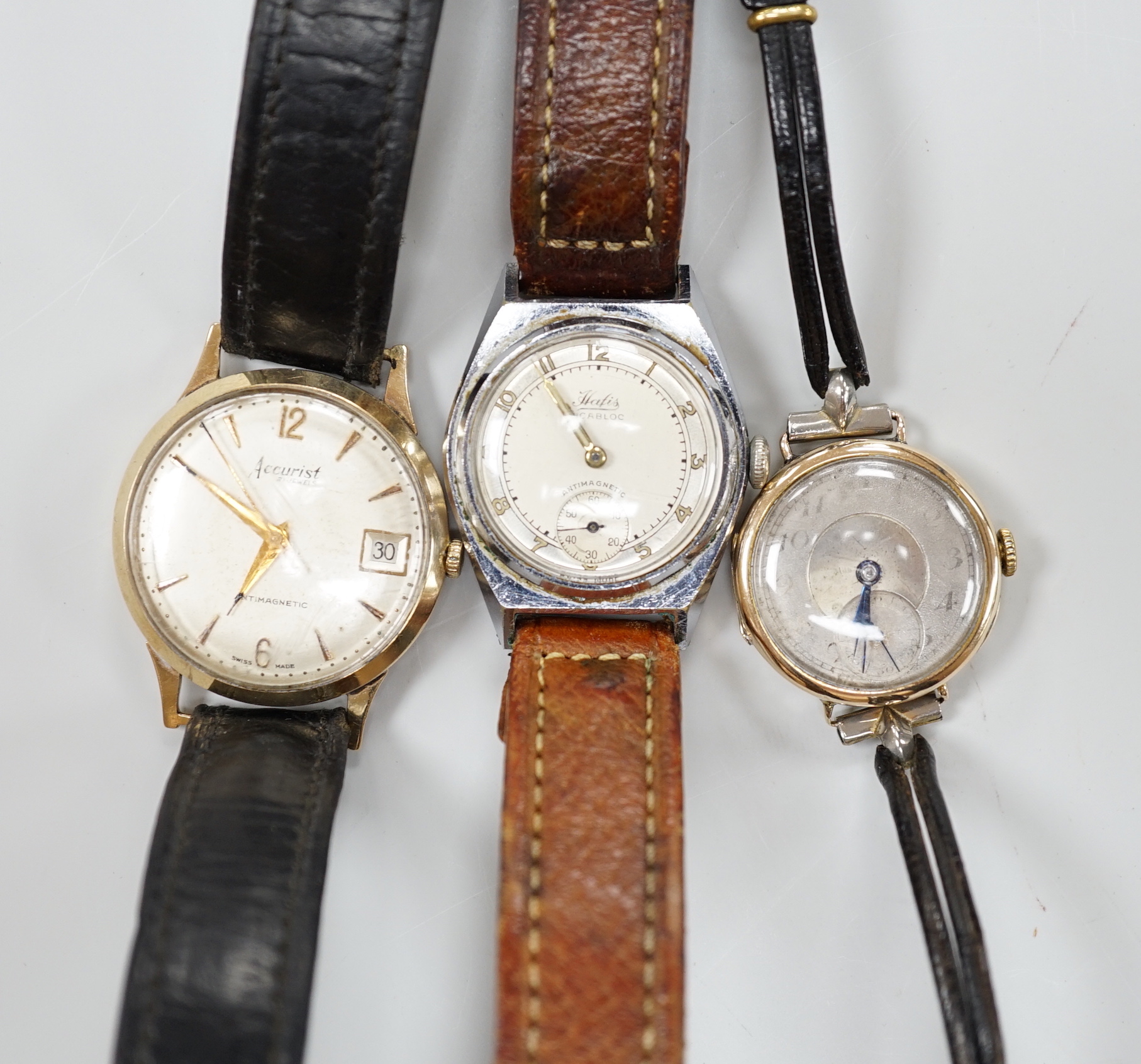 A lady's 9ct manual wind wrist watch, with Arabic dial and subsidiary seconds, a gentleman's yellow metal Accurist manual wind wrist watch and a steel Hatis watch.